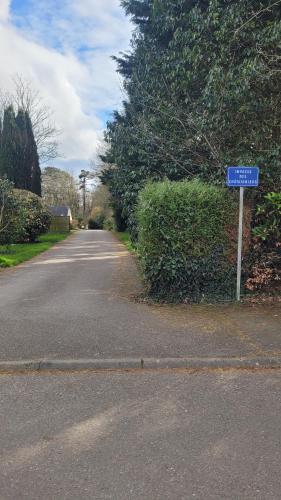 a street sign on the side of a road at Une pause à la campagne Classé 2 étoiles in Saint-Urbain