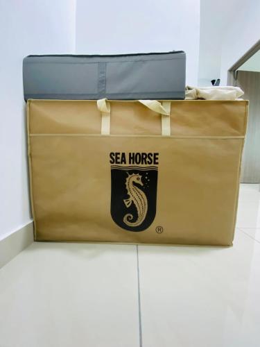 a couple of bags sitting on top of a floor at SKS Larkin Stadium Larkin Terminal Bus Town Area JB City in Johor Bahru