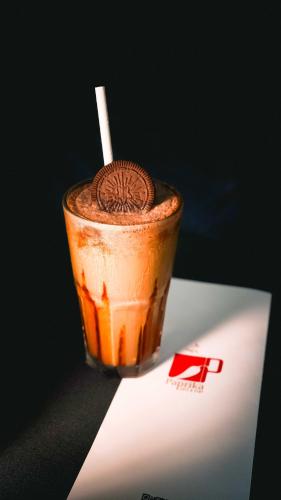 a drink sitting on top of a white plate at Paprika Stays Panjim Donapaula in Panaji