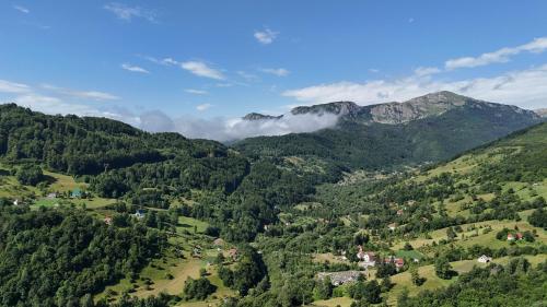 an aerial view of a valley in the mountains at FERN FARM ECO RESORT in Mojkovac