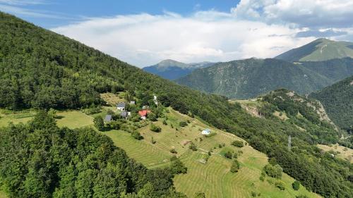 an aerial view of a farm in the mountains at FERN FARM ECO RESORT in Mojkovac