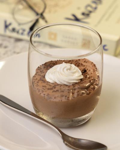 a glass jar of chocolate pudding with whipped cream at Paprika Stays Panjim Donapaula in Panaji