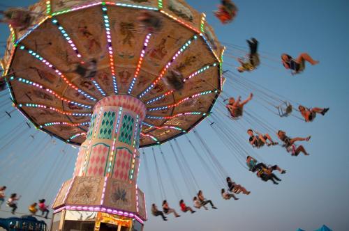 a ferris wheel at a carnival with people on it at Park Inn by Radisson Palace in Southend-on-Sea