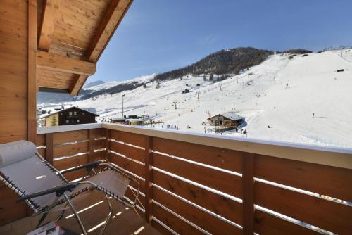 a balcony with a view of a ski slope at MOTA hotel in Livigno