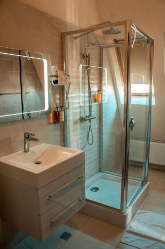 a bathroom with a shower and a sink at Forest Retreat&Spa in Oveselu