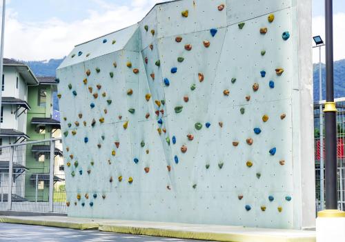 a large rock wall with a climbing wall at Geo 38 Residence Genting Highlands in Genting Highlands