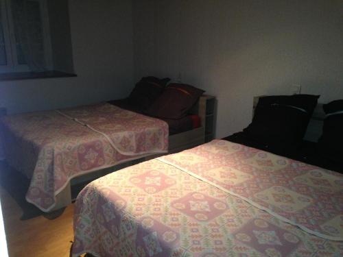 a room with two beds and a couch at Marie France 's home in Sacey