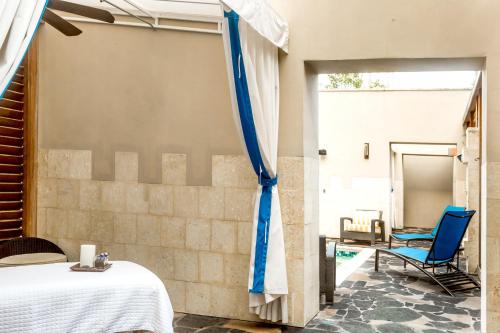 a room with a bed and a patio at Wyndham Grand Orlando Resort Bonnet Creek in Orlando