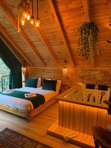 Ένα ή περισσότερα κρεβάτια σε δωμάτιο στο Hoşdere Bungalov