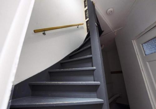 a set of stairs in a house with a door at City suite 3 in Eindhoven