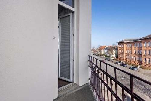 a balcony with a view of a city street at Altstadt Residenz in Lübeck