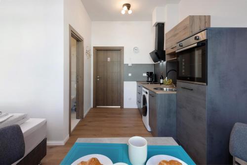 a kitchen with a table with a plate of food on it at Altstadt Residenz in Lübeck