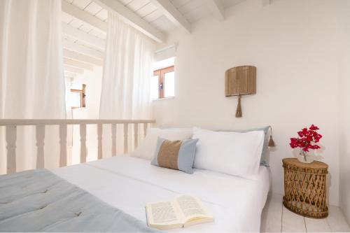 Ένα ή περισσότερα κρεβάτια σε δωμάτιο στο Melenia House