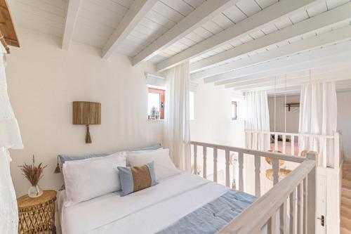 Ένα ή περισσότερα κρεβάτια σε δωμάτιο στο Melenia House