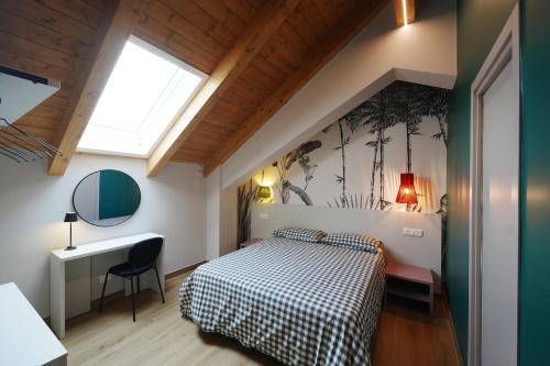 a bedroom with a bed and a desk and a window at Terrazza 72 - Deluxe Room & Breakfast in Agerola