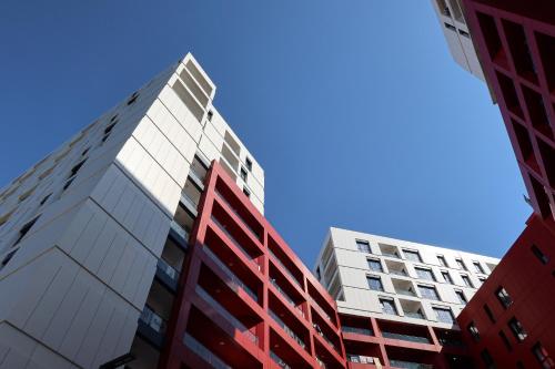 two tall buildings looking up at the sky at Bluemoon Retreat in Tirana
