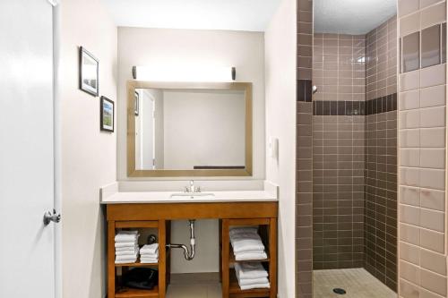 a bathroom with a sink and a shower at Comfort Inn Worland Hwy 16 to Yellowstone in Worland