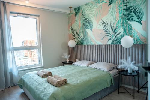 Ένα ή περισσότερα κρεβάτια σε δωμάτιο στο SEApartment z widokiem na morze