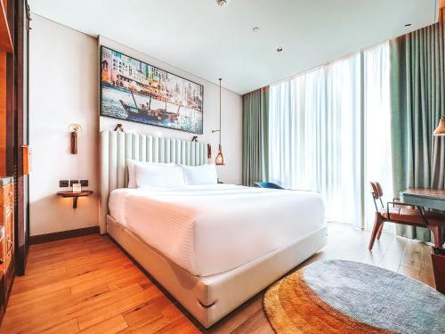 Postel nebo postele na pokoji v ubytování Revier Hotel - Dubai
