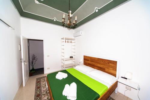 Postel nebo postele na pokoji v ubytování Visitsicilia Donn'Anna