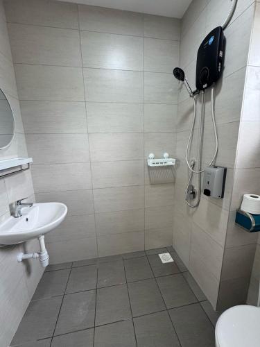 a bathroom with a shower and a sink at 4R3B NEW Kajang 2 Double Storey - 12 pax in Semenyih