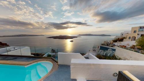 a villa with a swimming pool and a view of the ocean at NEOKLASSIKO KOUKOULI in Fira