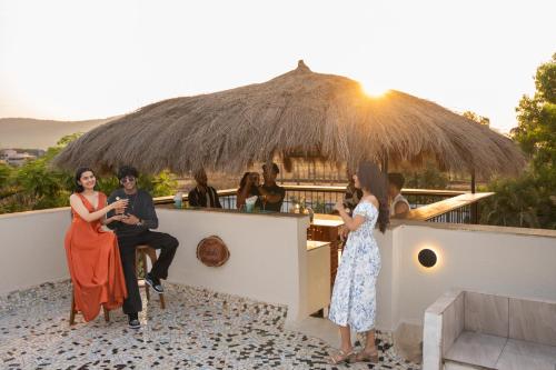 a group of people sitting around a bar at Voyage Zo Lonavala in Lonavala