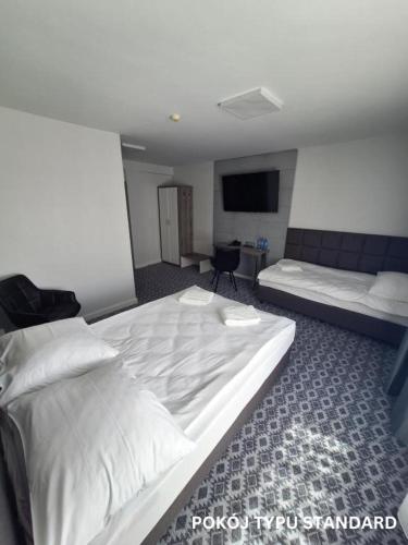 Una cama o camas en una habitación de Hotel Gordon