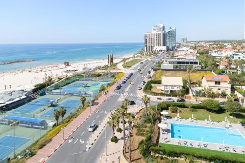 an aerial view of a city with a beach at Beach Duplex with 2 Terraces & Sea View by FeelHome in Herzliya Pituah
