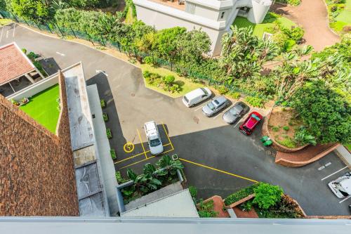 an overhead view of a parking lot with cars parked at Unit 62 Sealodge Umhlanga Beach in Durban