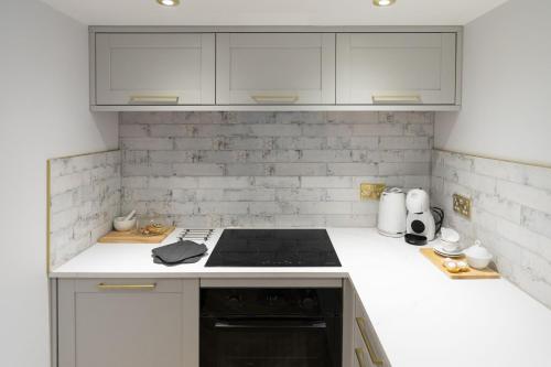 Kuchyň nebo kuchyňský kout v ubytování Bobbin Cottage