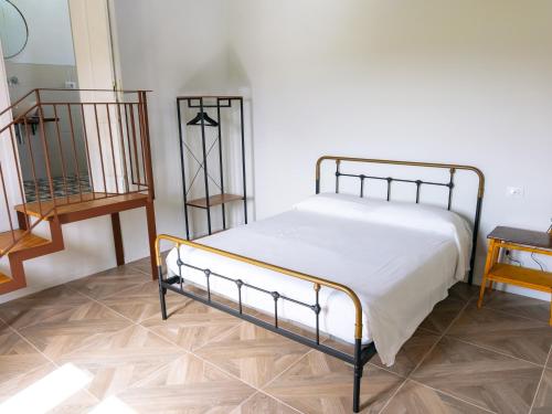 En eller flere senge i et værelse på Villa Rosaria