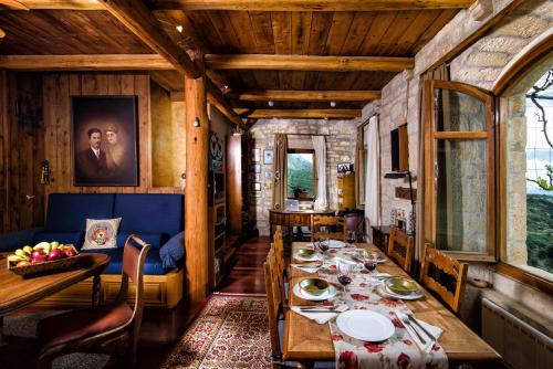 a dining room with a table and chairs at Panoramic View Villa in OliveGroves in Heraklio