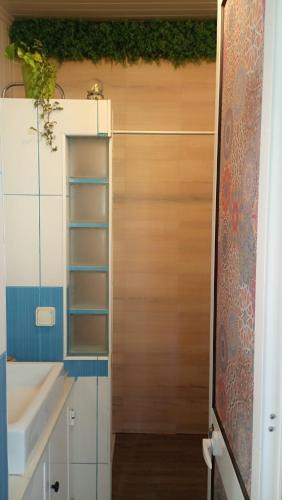 a bathroom with a sink and a mirror at Kanela Guest House B-side in Machico