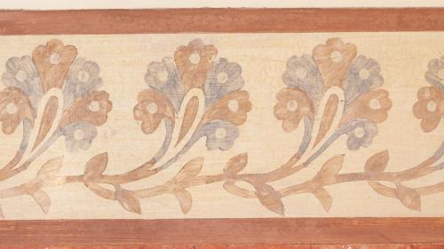 a wall with a painting of flowers on it at Hostal Oliva in Barcelona