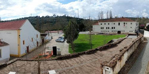 an aerial view of a town with a building and a car at Casa da Talha By Viva a Vida - Alojamentos & Hotels in Constância