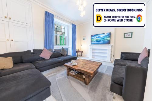 a living room with a couch and a coffee table at Town centre property convenient for the fells in Keswick
