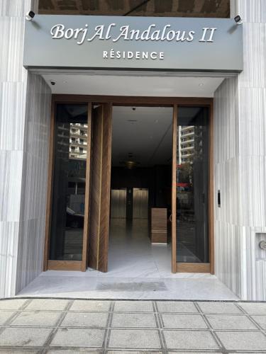an entrance to a building with a sign on it at Sky View Malabata Family only in Tangier