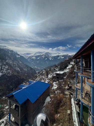 a view of the snow covered mountains from a house at Cafekush tosh in Tosh