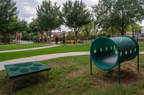 a playground with a green slide in a park at Modern Uptown 2BR Free Parking & Private Balcony in Charlotte