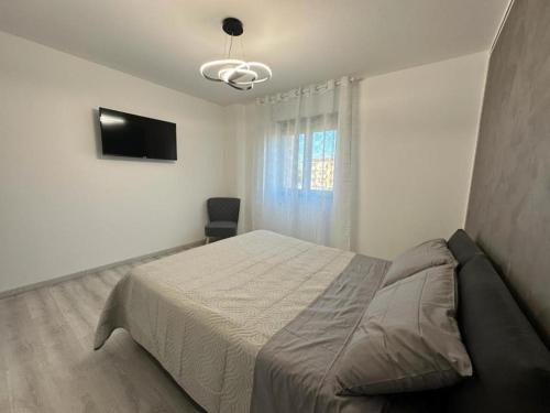 Postel nebo postele na pokoji v ubytování Sempione Apartment