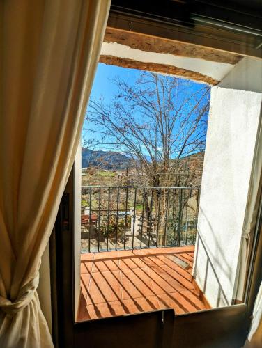 a view of a deck from a window at Casa Rural hasta 14 personas Alpujarra Granadina, La Almazara in Mecina Fondales