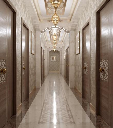 a hallway in a building with a chandelier at Volidam Hotel in Samarkand
