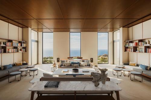 a living room with a couch and a table at One&Only Kéa Island in Pisses
