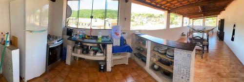 a kitchen with a counter top in a room at Casa my House in Lençóis