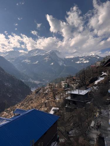 a view of a mountain with snow capped mountains at Cafekush tosh in Tosh