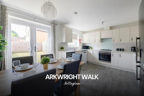 a kitchen and dining room with a table and chairs at Gorgeous 4-bed Home in Nottingham by Renzo, Free Driveway Parking, Great Location! in Nottingham