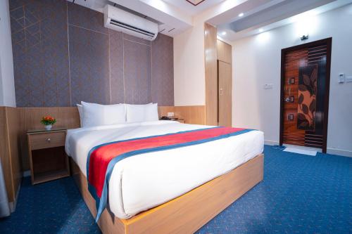 a bedroom with a large bed in a room at Hotel Safa Residency - DHAKA in Dhaka