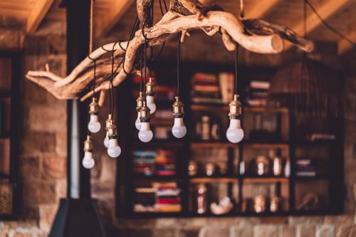 a bunch of lights hanging in a bar at Dakota forest retreat in Tsigov Chark