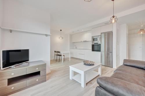 a living room with a couch and a table at Ripa by Clabao in Burlada